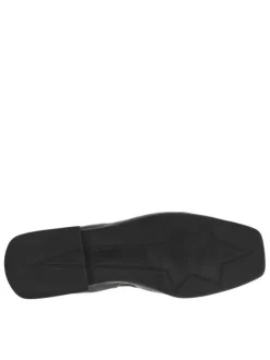 Ballerines décolletées en cuir noir à chainette dorée sur la cheville