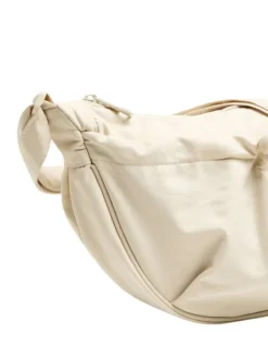 Banane écrue unie avec fermeture zippée et élastiquée en nylon
