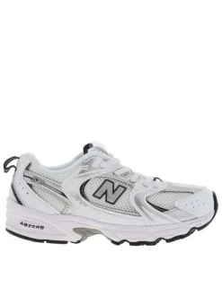 Baskets multisport 530 blanches avec multiples logos de la marques