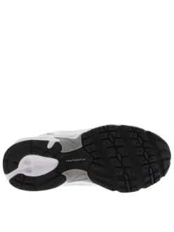 Baskets multisport 530 blanches avec multiples logos de la marques