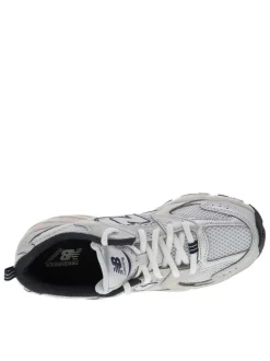 Baskets running blanches à talon plat en maille sur le pourtour