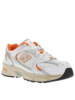 Baskets basses multisport 530 blanches et oranges en mesh avec lacets