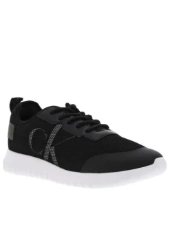 Baskets basses noires à semelle running à talon semi-compensé et tige slip-on