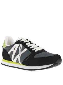 Baskets basses running noires avec des détails jaune fluo et des lacets plats