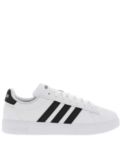 Baskets basses simili cuir blanc avec bandes noires latérales et lacets tressés blancs