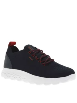 Baskets basses Slip-on en textile stretch texturé noir uni avec une semelle respirante et détails rouges