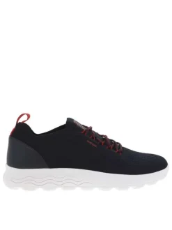 Baskets basses Slip-on en textile stretch texturé noir uni avec une semelle respirante et détails rouges