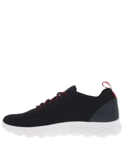 Baskets basses Slip-on en textile stretch texturé noir uni avec une semelle respirante et détails rouges