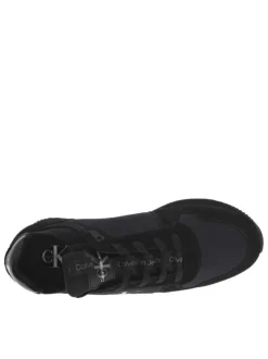 Baskets basses style running en cuir noir à talon plat avec logo iconique