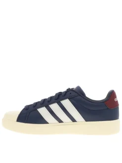 Baskets bleues avec un talon plat pourvu de lacets et de bandes blanches