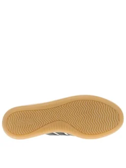 Baskets en cuir blanches avec semelle à talon plat et fermeture à lacets