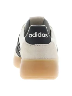 Baskets en cuir blanches avec semelle à talon plat et fermeture à lacets