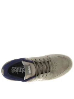 Baskets kaki en cuir à talon plat avec des lacets et un logo blanc