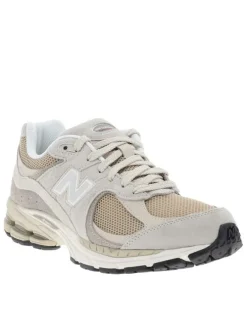 Baskets multisport 2002 beige à talon plat avec du mesh sur le pourtour