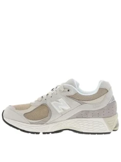 Baskets multisport 2002 beige à talon plat avec du mesh sur le pourtour