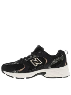 Baskets multisport en cuir noires avec empiècements tachetés et maille résille