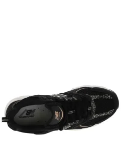 Baskets multisport en cuir noires avec empiècements tachetés et maille résille