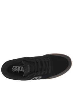 Baskets noires en cuir à talon plat avec des lacets et logo gris