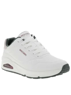 Baskets running blanches avec un talon compensé bas et des lacets