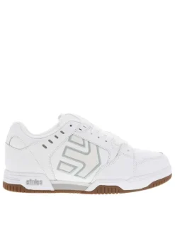 Baskets skate blanches en cuir à semelle marron avec logos verts et lacets plats