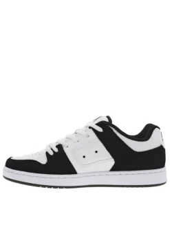Baskets skate en cuir noires et blanches à talon plat avec des logos noirs