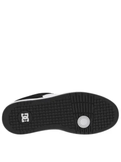 Baskets skate en cuir noires et blanches à talon plat avec des logos noirs