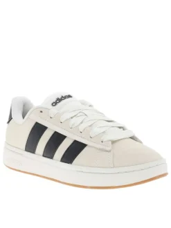 Baskets tennis blanches en cuir avec un talon plat et des lacets