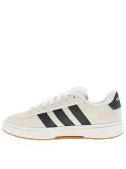 Baskets tennis blanches en cuir avec un talon plat et des lacets