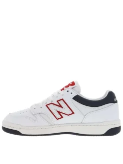 Baskets tennis en cuir blanc avec monogramme rouge à talon plat et à lacets