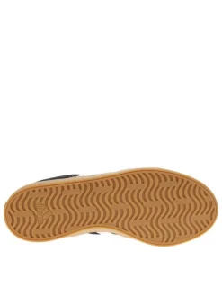 Baskets tennis noires plates et à lacets avec bandes blanches et liserés dorés
