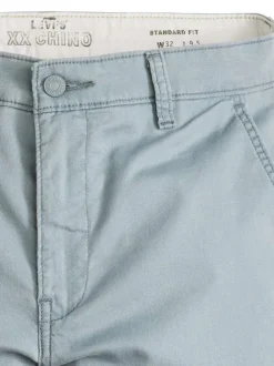 Bermuda chino en coton mélangé bleu uni à coupe droite avec des poches