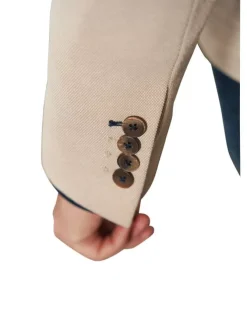Blazer de costume beige uni avec une coupe ajustée et un col cranté