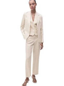 Blazer en lin beige clair uni à coupe cintré avec des poches passepoilées
