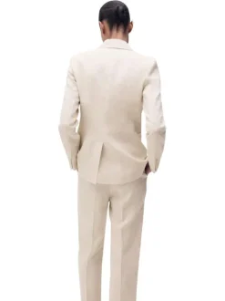 Blazer en lin beige clair uni à coupe cintré avec des poches passepoilées
