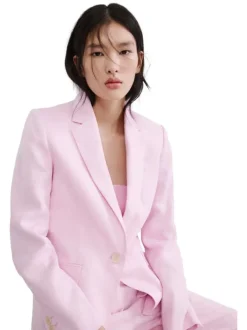 Blazer en lin rose uni pourvu d'une coupe droite et d'un col à revers