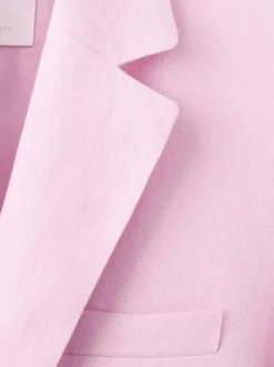 Blazer en lin rose uni pourvu d'une coupe droite et d'un col à revers