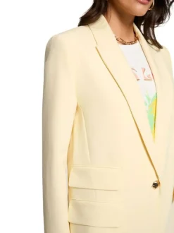 Blazer jaune à coupe droite pourvu d'un col à revers et de manches longues