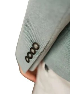 Blazer vert en maille fine avec une coupe ajustée et des poches