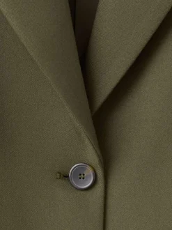 Blazer vert uni avec une coupe droite et un un col cranté à revers