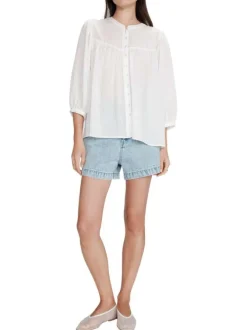 Blouse blanche unie avec une coupe droite et un col rond et des boutons