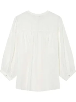 Blouse blanche unie avec une coupe droite et un col rond et des boutons