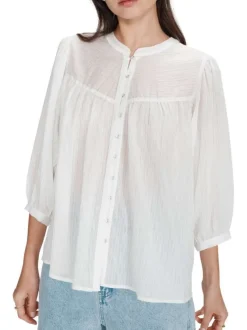 Blouse blanche unie avec une coupe droite et un col rond et des boutons