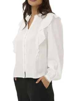 Blouse blanche unie pourvue d'une coupe droite et d'un col tunisien