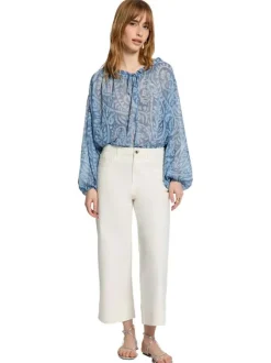Blouse bleue à coupe ample pourvu d'un col v et de manches longues