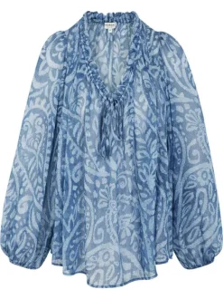 Blouse bleue à coupe ample pourvu d'un col v et de manches longues
