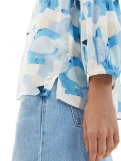 Blouse bleue imprimée avec une coupe droite col v et manches longues