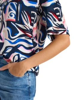 Blouse bleue à motifs avec une coupe droite et un col tunisien
