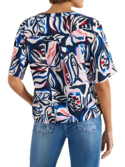 Blouse bleue à motifs avec une coupe droite et un col tunisien