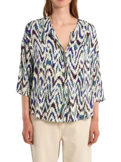 Blouse bleue à motifs pourvue d'une coupe droite et de manches longues