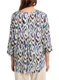 Blouse bleue à motifs pourvue d'une coupe droite et de manches longues